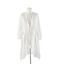 The Gift Craft Swimsuit Cover Up in White, featuring long sleeves, a V-neck, knee-length cut, and a waist tie, is shown on a plain mannequin against a white background.
