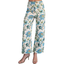 A woman wears FASHION GO Floral Ankle Cropped Pants featuring a high-waisted, wide-leg fit with a blue and yellow floral print, paired with open-toe heeled sandals.