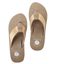 The Yellow Box Leyla Wedge Flip Flop Sandal features tan impact-reducing footbeds, textured woven beige straps, and a white daisy graphic.