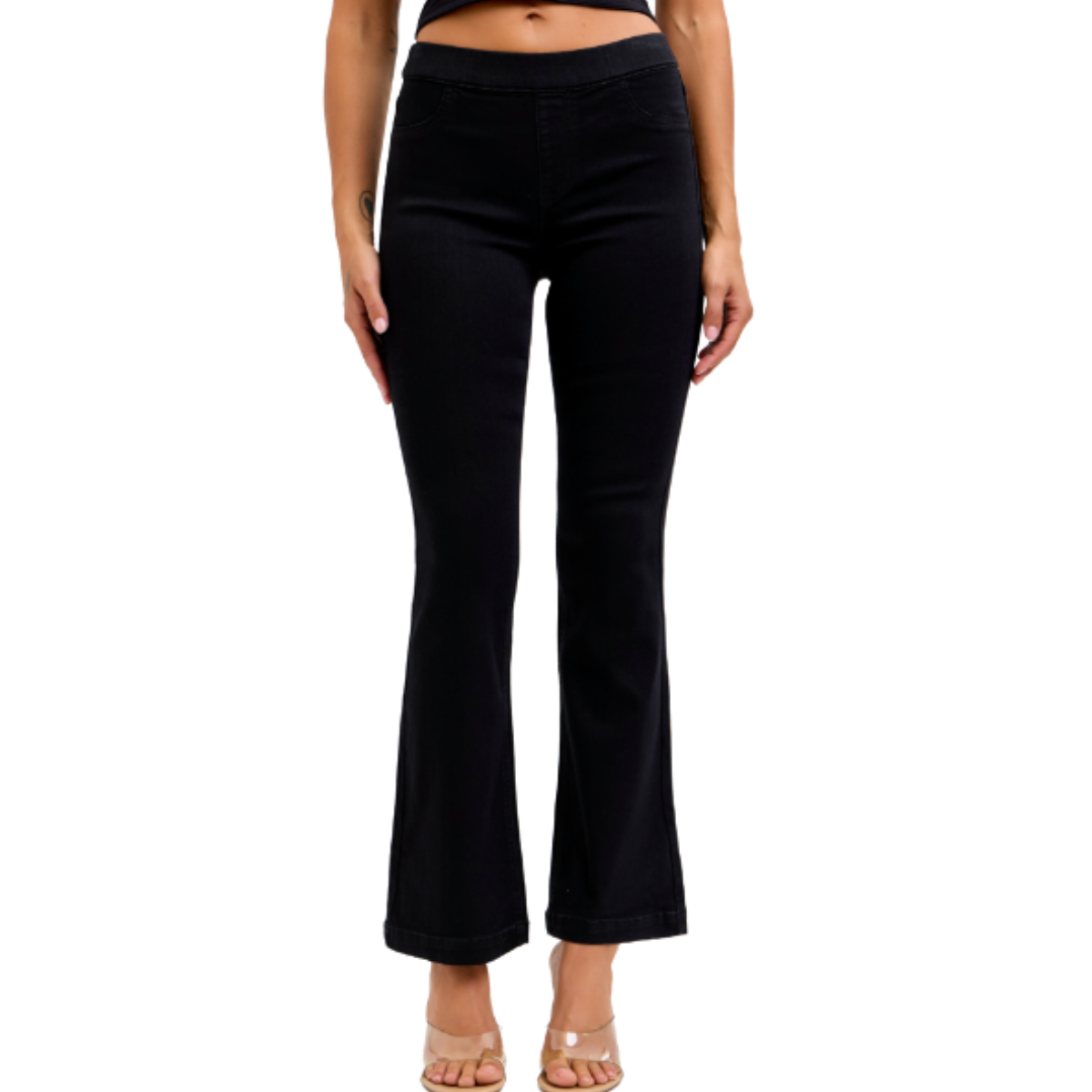 A person models the FASHION GO Cello Pull On Jeans in Black with a 30" inseam, styled with heeled sandals, shown from shoulders to feet against a white background.