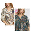Two women model the Umgee Boho Paisley Puff Sleeve Blouse in two different colors—cream and teal—each showcasing a split neckline and three-quarter puff sleeves.