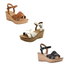 Three pairs of White Mountain Simple Wedges with cork soles and ankle straps in brown, white, and black are displayed on a white background.