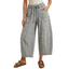 Model wearing Mineral Wash Barrel Fit Utility Knit Pants by FASHION GO—wide-leg, gray French terry with front pockets and a drawstring waist—paired with brown sandals, standing against a white background. Upper body and face are not visible.