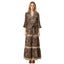 A woman stands against a white background wearing the FASHION GO Brown Boho Print Paisley Dress, a maxi dress with a tie waist, ruffled sleeves, horizontal striped accents near the hem, and a split V-neckline that creates a relaxed, bohemian vibe.