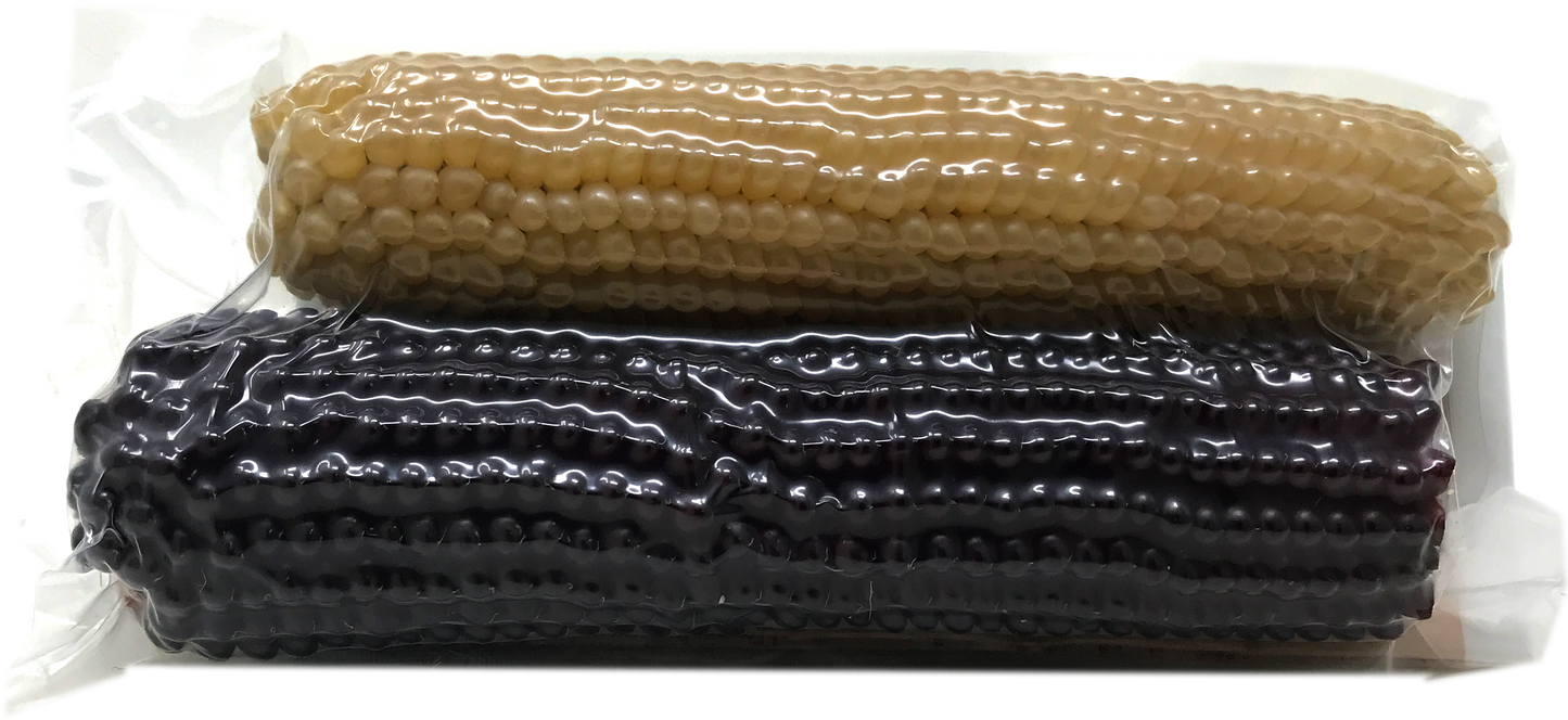 Amish Country Popcorn’s Twin Microwave Popcorn Cobs feature one yellow and one deep purple cob vacuum-sealed side by side in clear plastic packaging, creating a unique twin pack popcorn experience.