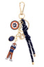 The Canvas Style Auburn Tigers Cluster Bag Charm in Navy features 18K gold plating and Auburn University-inspired charms, including a logo, blue gem, letter “A,” navy rope, and an Auburn Tigers mascot charm wearing an “Aubie” sweater—making it the perfect accessory for any fan.
