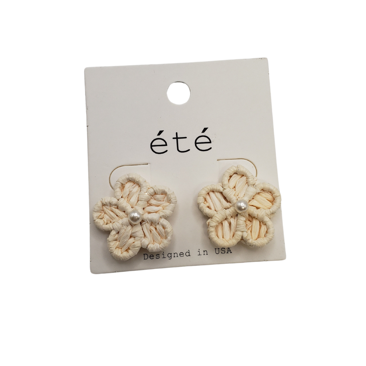 The "Rattan Flower Earrings with Pearl Center" by SPECIAL EFFECTS feature elegant woven rattan in a flower shape with a central pearl-like bead, highlighting craftsmanship and the label "Designed in USA.