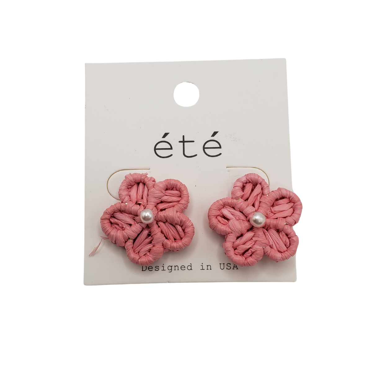 Rattan flower-shaped earrings with pearl centers on a white card labeled "SPECIAL EFFECTS, Designed in USA." These trendy earrings blend delicate design with timeless charm.