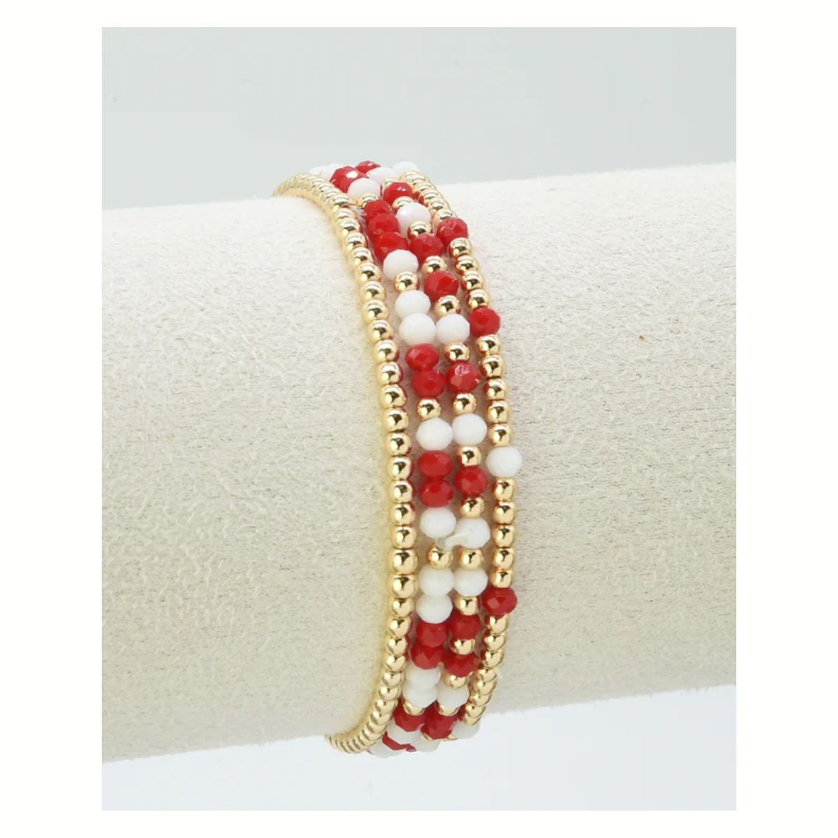The FASHION GO Set of 4 Glass Bead and Gold Stretch Bracelets features alternating red and white beads—perfect for gameday to show off your team colors in style.