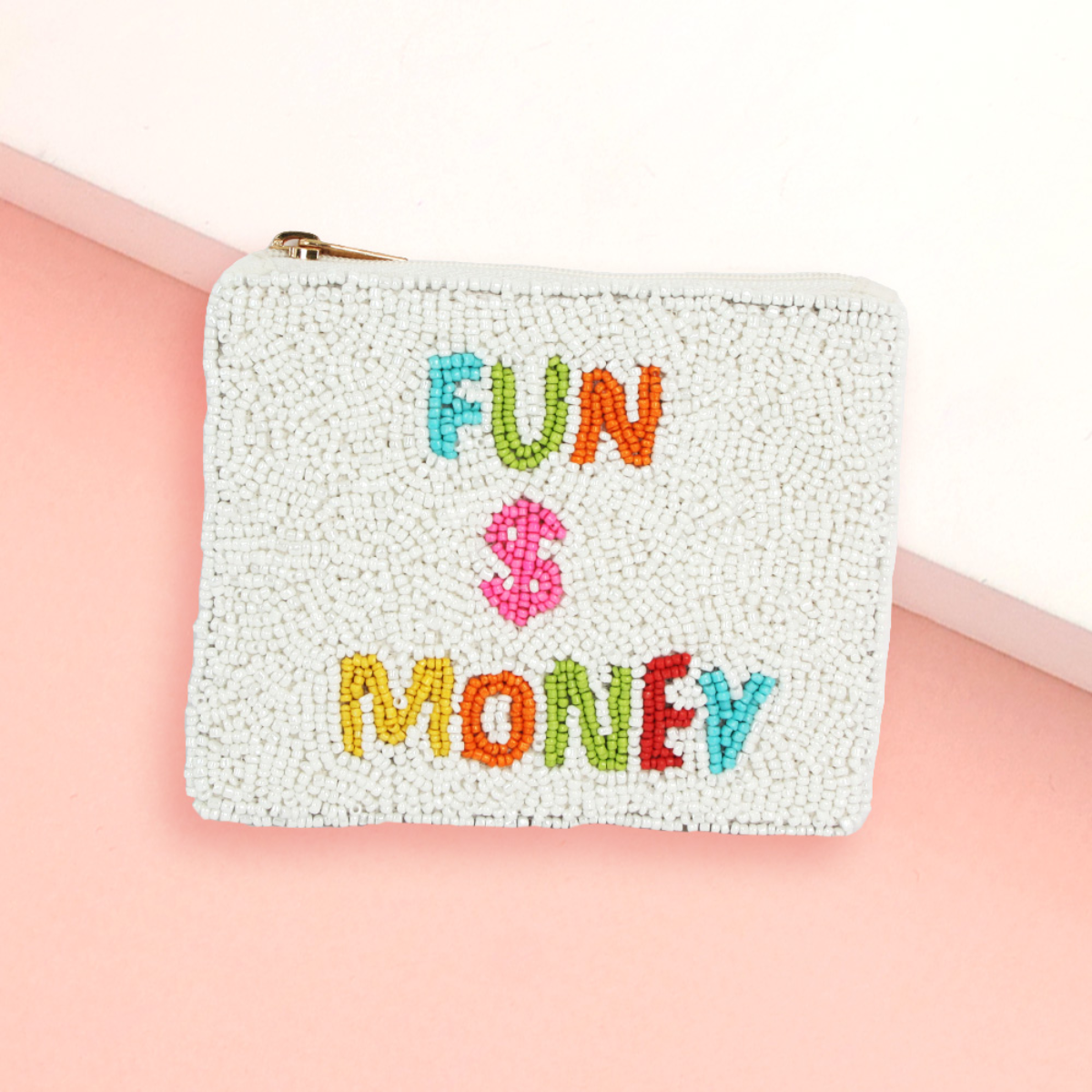 The Seed Bead Accented Mini Pouch Bag Assorted by Wona Trading features "FUN $ MONEY" in colorful letters on a pink and white background—an ideal gift for any fashionista.