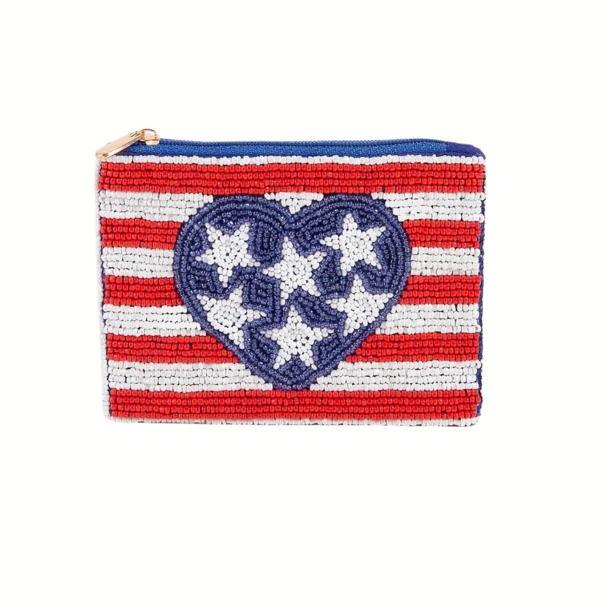The Seed Bead Accented Mini Pouch Bag Assorted by Wona Trading features red and white horizontal stripes, a central blue heart with white stars, and a blue zipper—making it a charming fashion accessory gift.