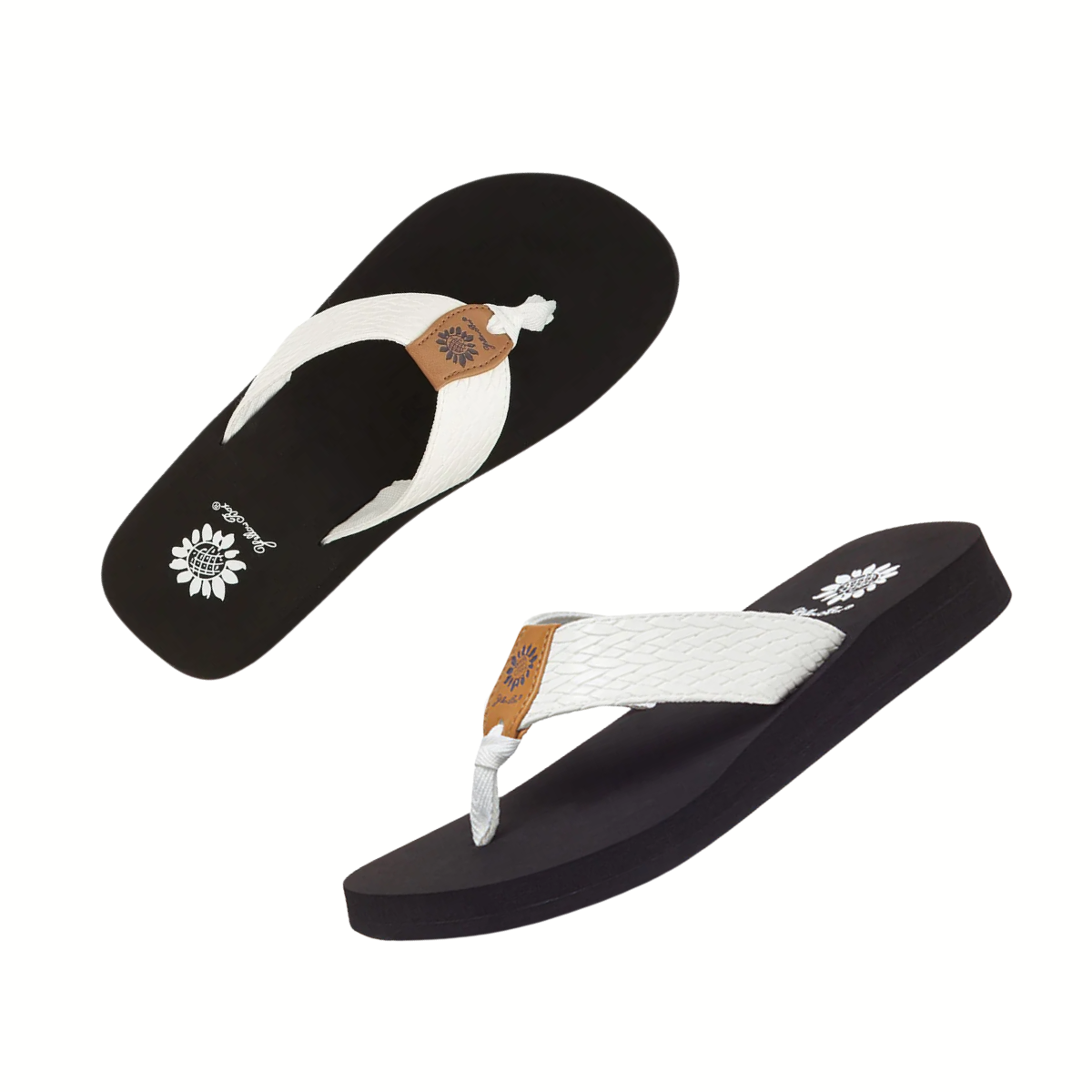 The Flax Flip Flop by Yellow Box features black sandals with white woven textured straps, tan accents, and a floral design on the insole.