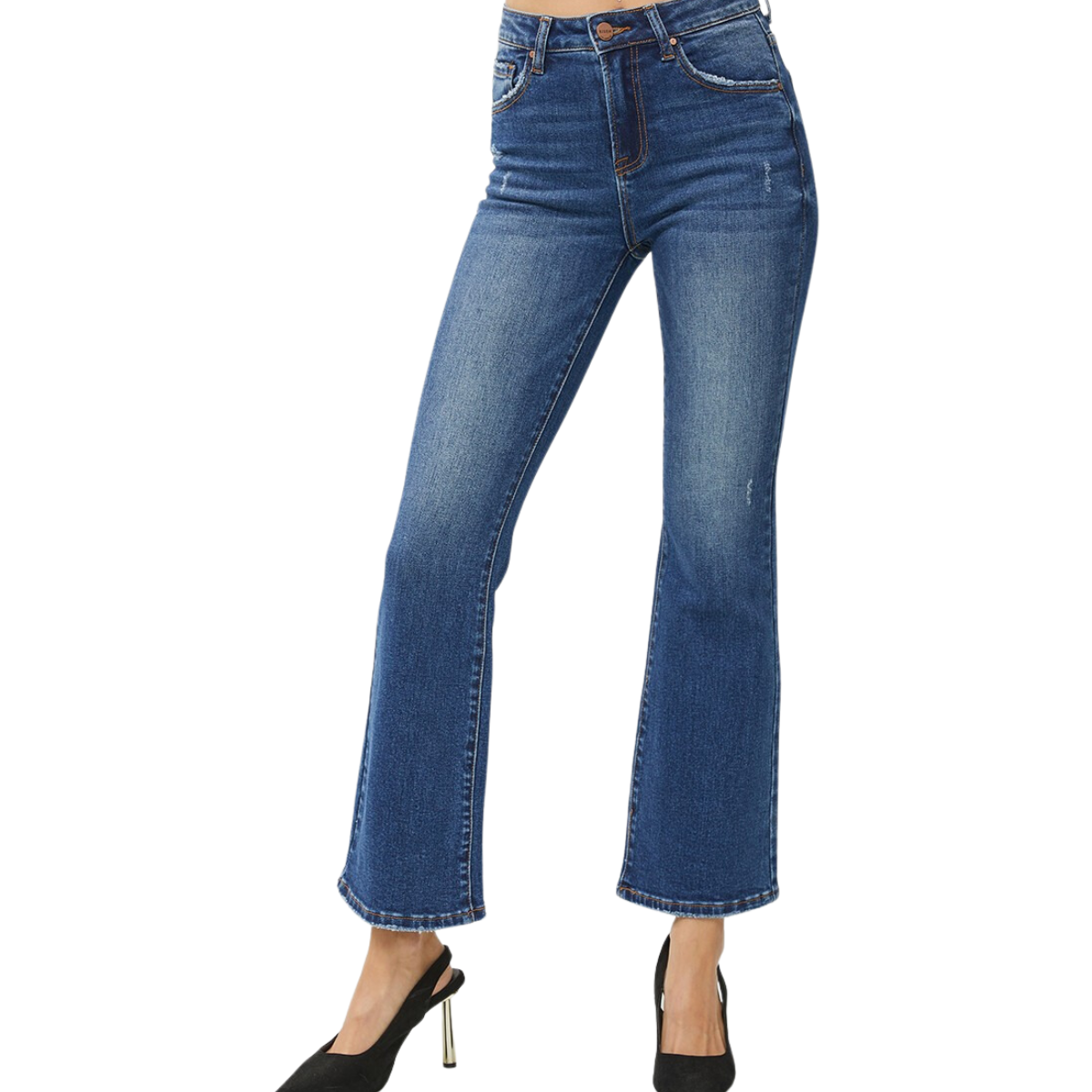 Woman wearing Mid Rise Crop Flare Jeans in Medium Wash by Risen from FASHION GO with black high heels, isolated on a white background.