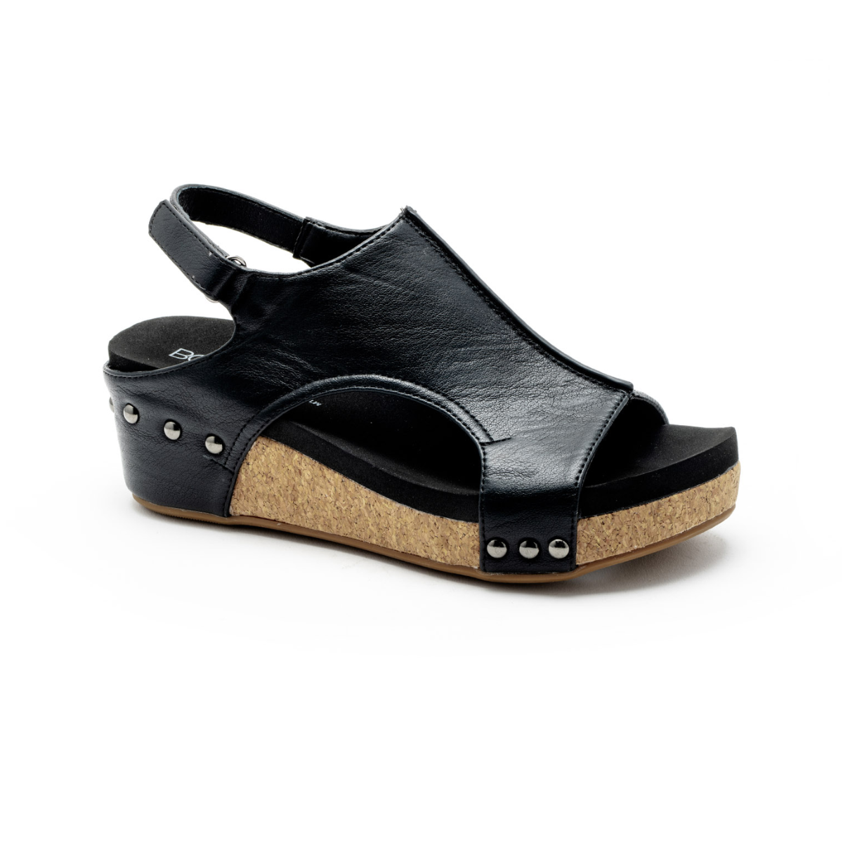 The Volta II Wedge in Black Smooth by CORKY'S FOOTWEAR INC is a vegan leather sandal with a cork wedge heel and black sole, featuring an open toe, back strap, and metal studs along the side.