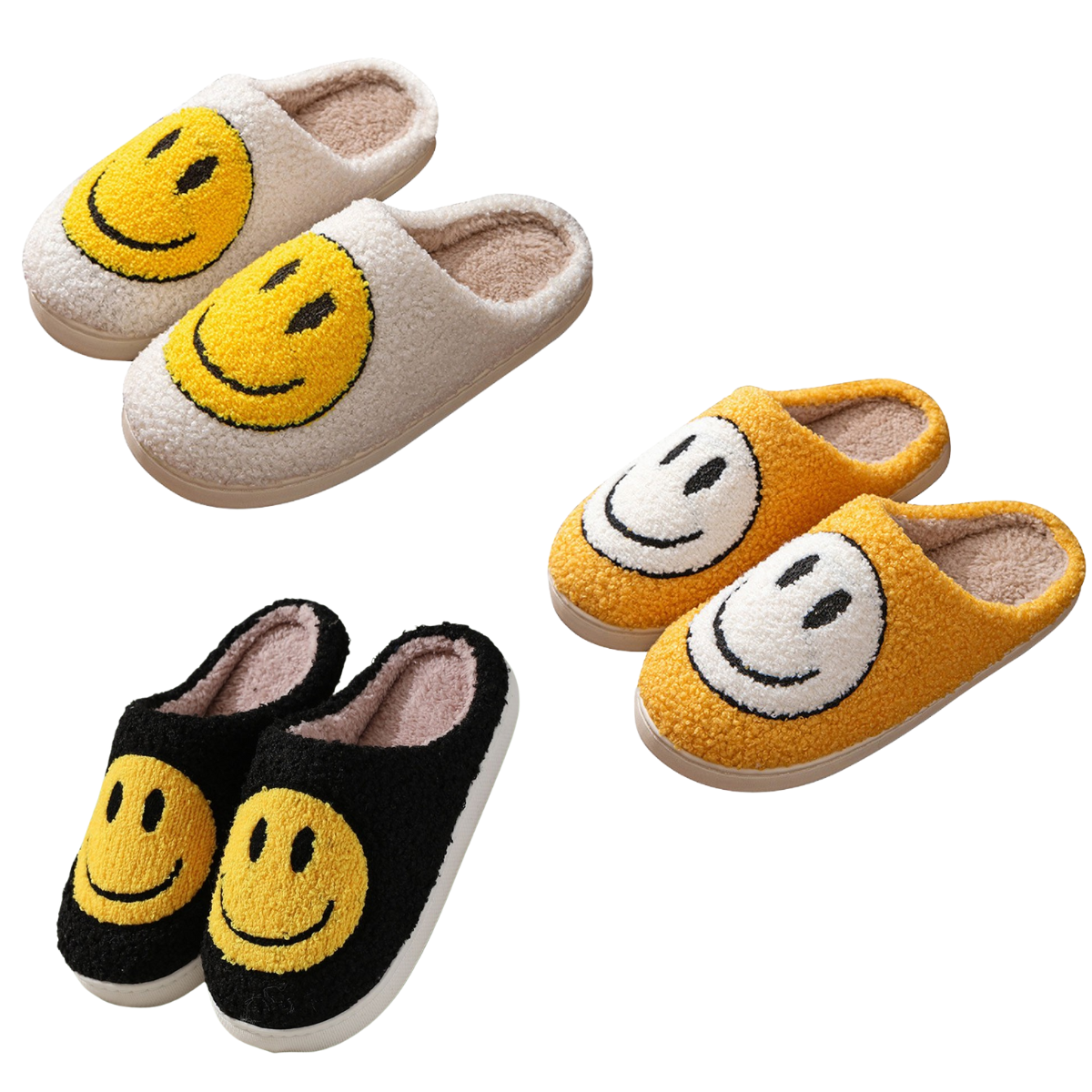 Three pairs of Zenana Smiley Slippers in white, yellow, and black, each with a large smiling face design on top and an easy open back style, are displayed on a white background.