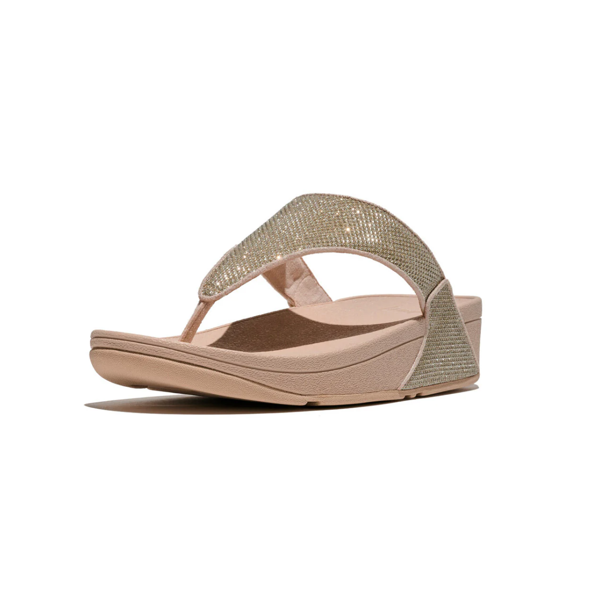 The Lulu Shimmerglitz Flip-Flop in Platino by FITFLOP USA LLC features glittery mesh straps, an open toe, and Microwobbleboard cushioning for all-day comfort. Shown from a low angle on a white background.