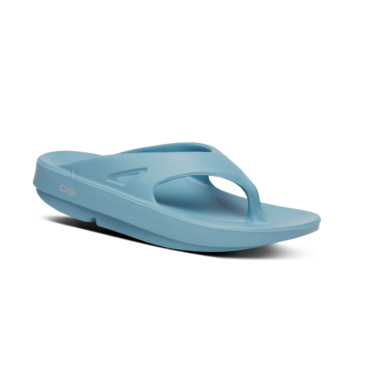 The OOFOS LLC Oofos Ooriginal Thing Ocean Blue flip-flop sandal, shown angled on a white background, features OOfoam recovery technology and a thick sole—perfect for post-workout recovery.