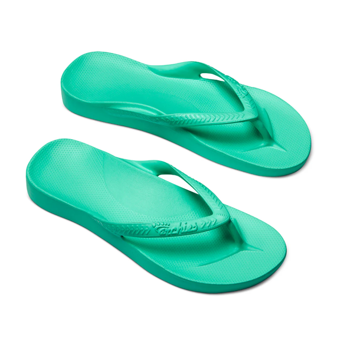 A pair of mint Archies flip flops by ARCHIES FOOTWEAR LLC, known for comfort and featuring textured straps, soles, and arch support, elegantly angled on a pristine white background.