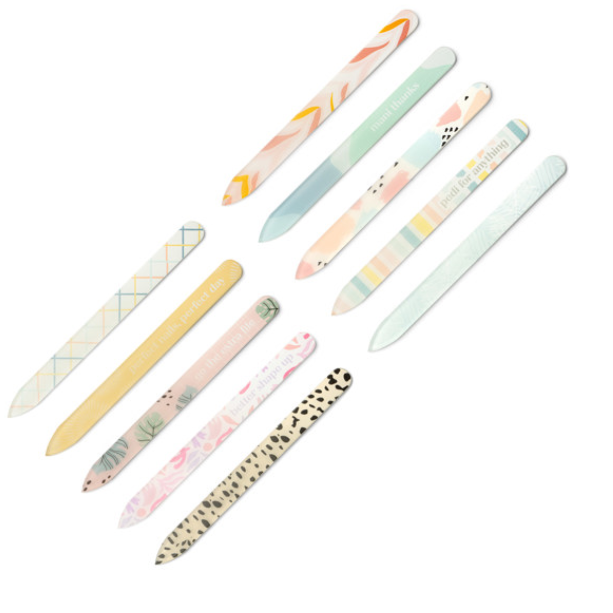The Glass Nail Files Assorted Patterns by DM MERCHANDISING INC includes twelve durable, colorful files with long-lasting grit and patterns like stripes, polka dots, and florals on a white background. Safe for natural nails, they blend style and reliability.