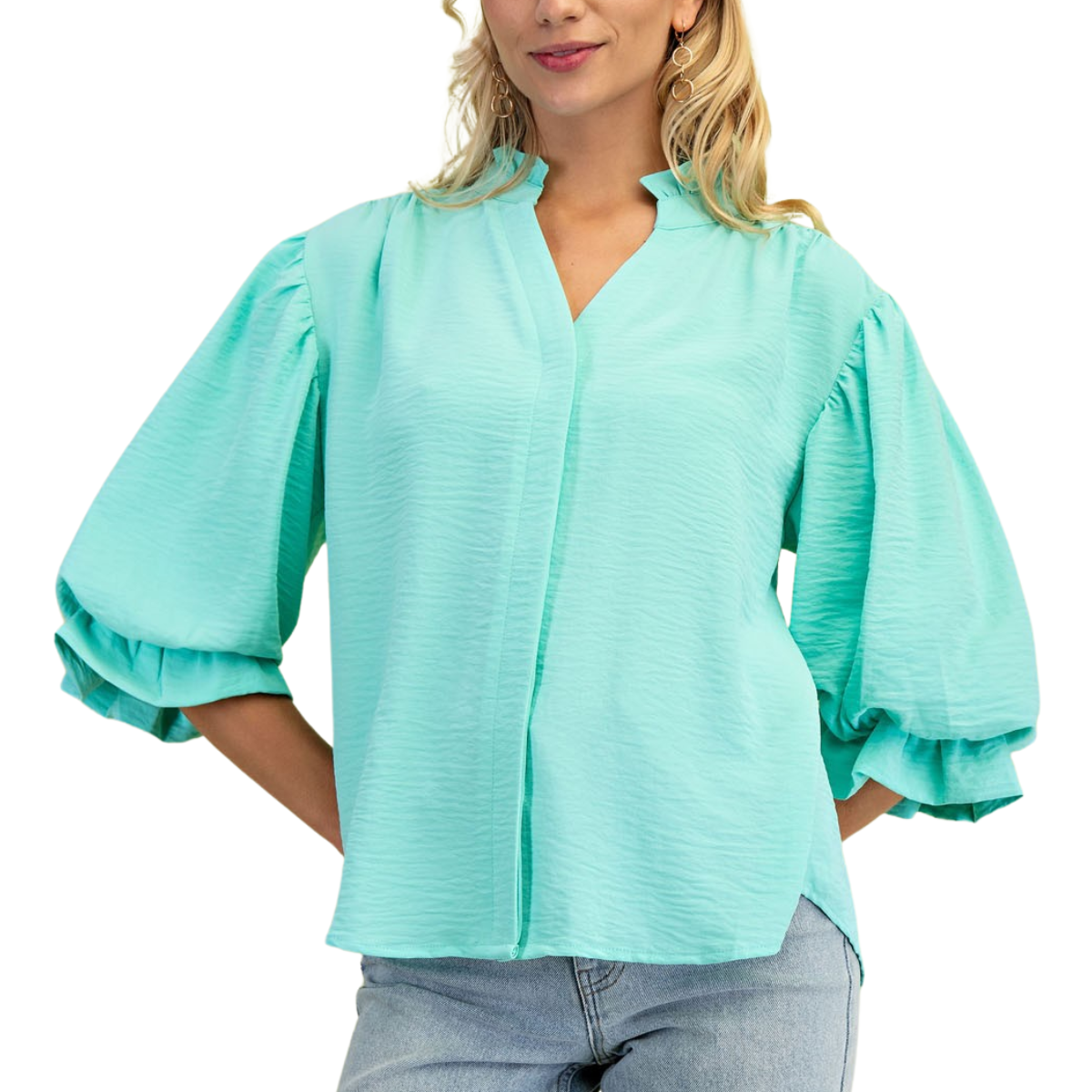 A person wears a FASHION GO light blue 3/4 Length Gathered Balloon Sleeve Blouse made of polyester, standing against a white background and perfectly paired with light blue jeans.