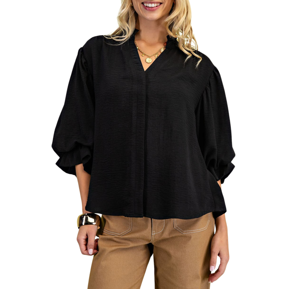 A person in a black V-neck 3/4 length gathered balloon sleeve blouse by FASHION GO pairs it with tan pants. They have blonde hair and gold jewelry.