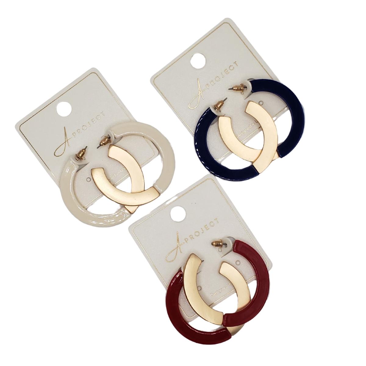 SPECIAL EFFECTS offers three pairs of Split Matte Gold and Colored Flat Hoop Earrings on cards: one elegant white and gold, another rich navy and gold, and a third vibrant red and gold, each showcasing luxurious gold with a stylish twist.