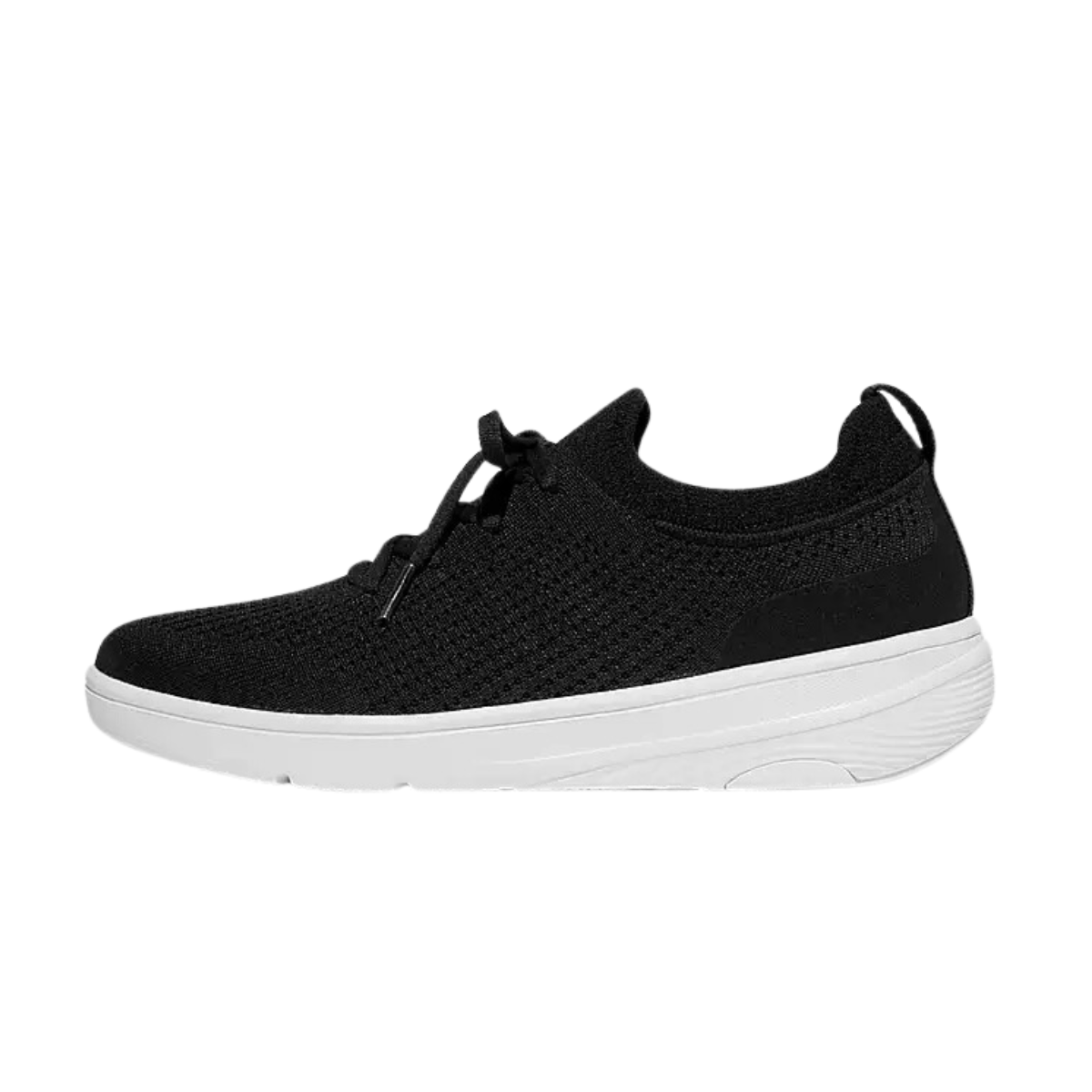 The Super Q Knit Slip-on Sneaker in Black by fit flop is a black athletic shoe with an engineered knit upper and sleek white sole.