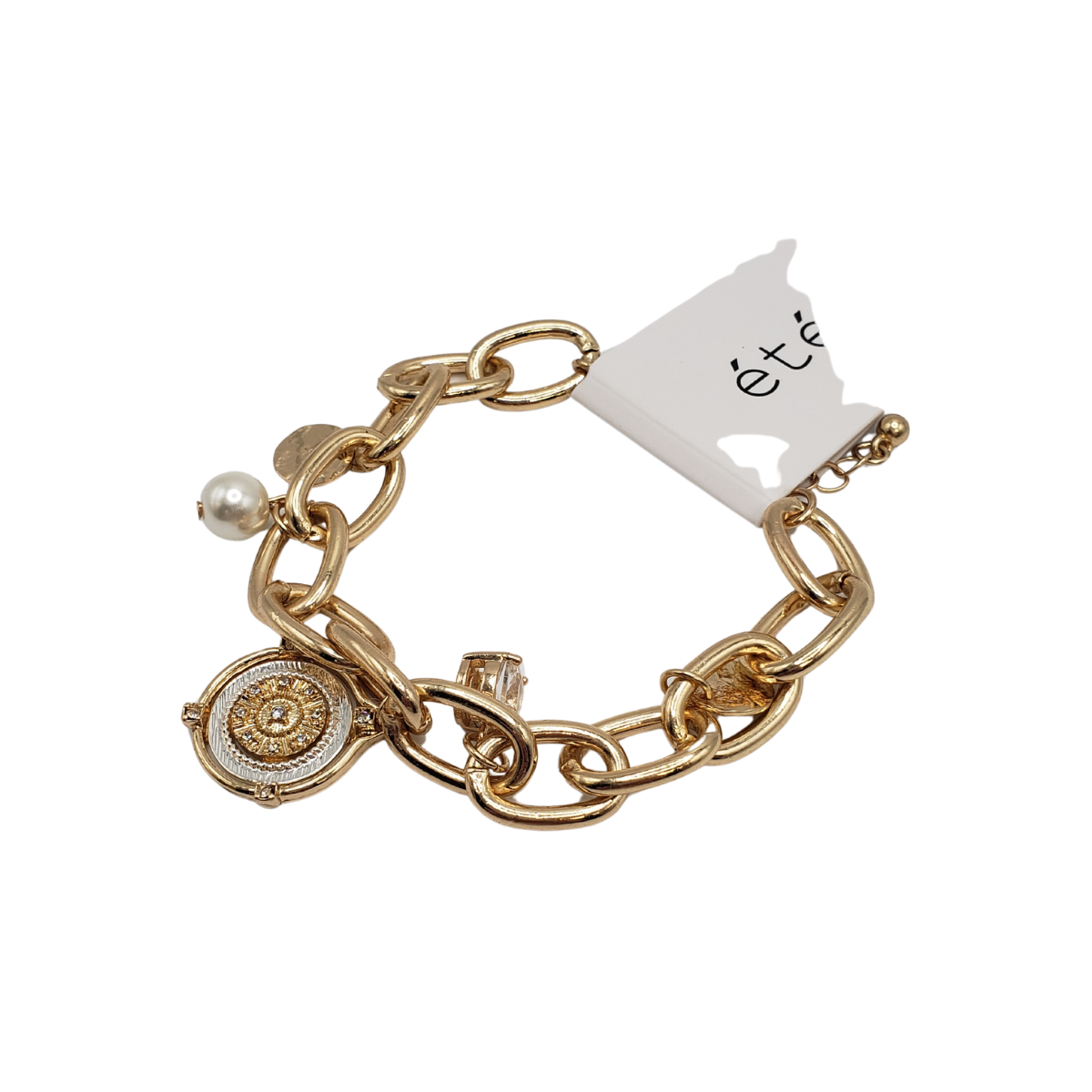 The 2 Tone Disc "Coin" and Pearl Bracelet from SPECIAL EFFECTS is a gold chain bracelet with a sophisticated look, featuring a disc coin charm, pearl, and small clear stone.