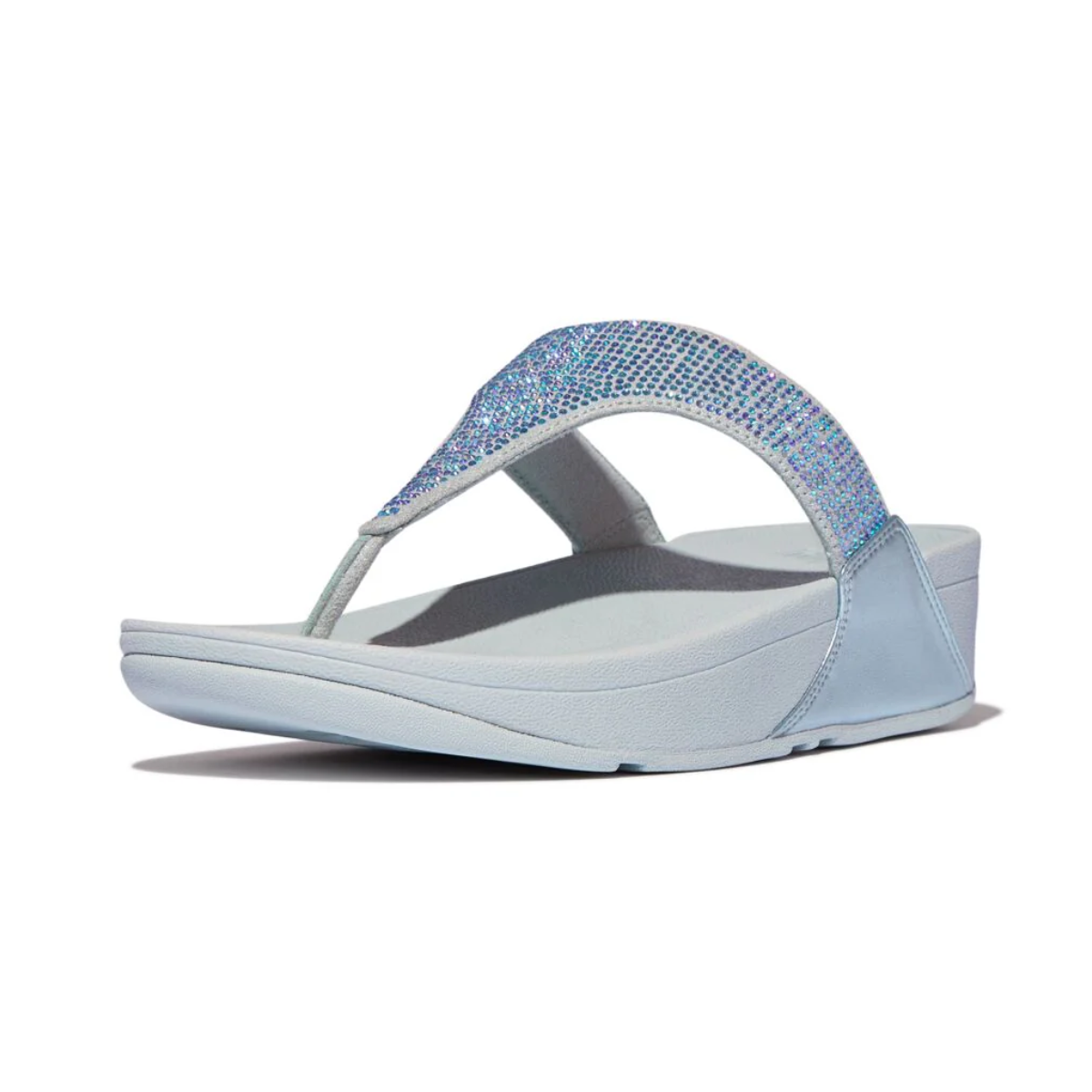 The Lulu Crystal Embellished Flip Flops in Quiet Blue by FITFLOP USA feature a rhinestone-studded strap, wedge heel, and Microwobbleboard midsoles for stylish comfort.
