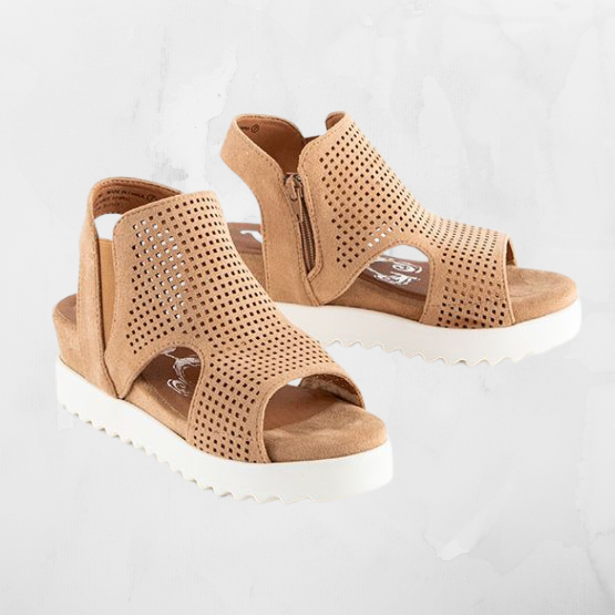 The Amy 2 White Sole Sandals in Sand by Very G have perforated detailing and a thick white sole, ideal for summer adventures. With an easy inside zip closure at the back, these stylish sandals from VERY G complement any warm-weather look.