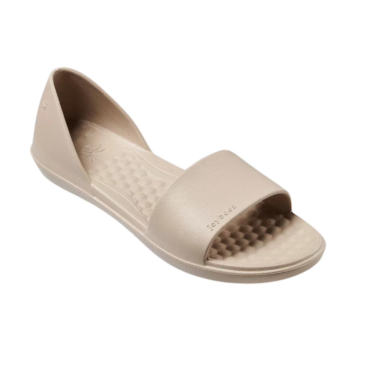 The Friday Flat in Driftwood by Joybees, from Flipflops & Whatnots, is a beige open-toe flat sandal with a textured footbed and wide front strap, made from lightweight EVA for comfort and style at happy hour.