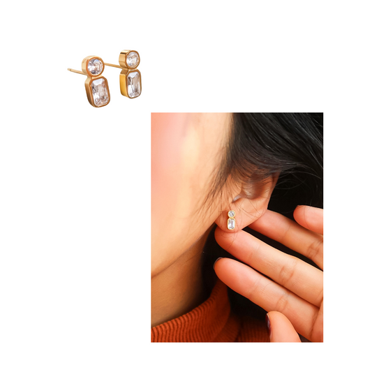 The 18K Gold Non-Tarnish Mini CZ Stud earrings by Flanerie feature rectangular and circular gemstones. Displayed alone and worn by a model with long dark hair, these studs epitomize timeless elegance.