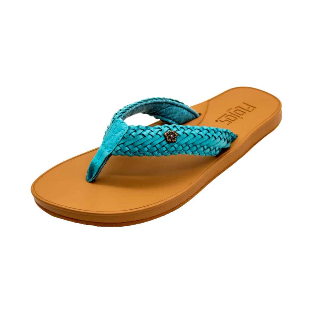 The FLOJOS Waverly Braided Strap Flip Flop is a tan women's sandal with a teal braided strap, a decorative emblem, and a memory foam footbed for all-day comfort.