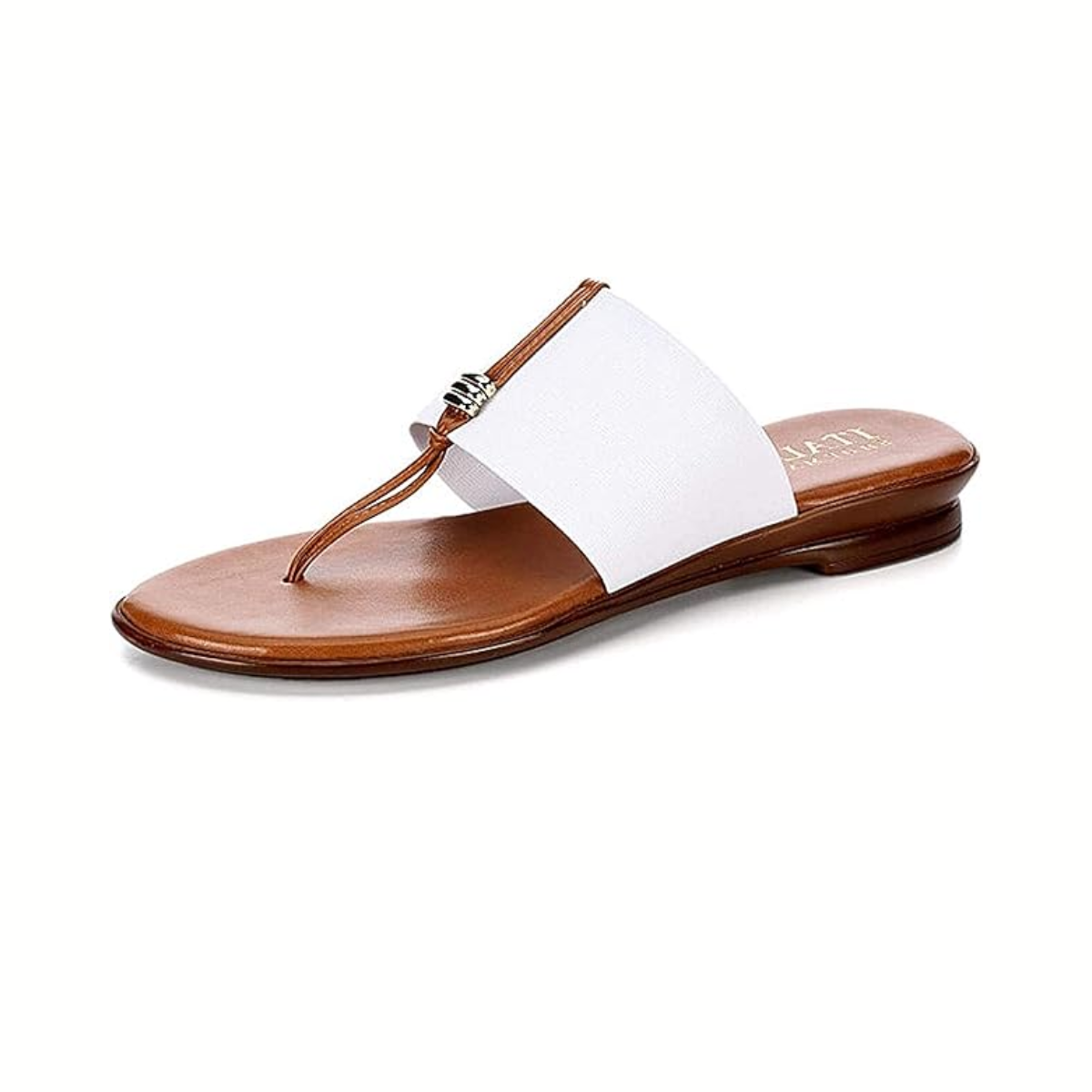 The Avanti Belle Thong Sandal in White features a stretch upper, wide white strap, thong toe design, thin sole, subtle metallic accent, and is available in whole sizes.