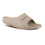 The Women's OOfos OOahh Slide Sandal - Nomad by OOFOS LLC is a beige sandal with a thick sole, patented footbed for impact absorption, two cutouts on the upper, and a textured footbed, shown in a side view.