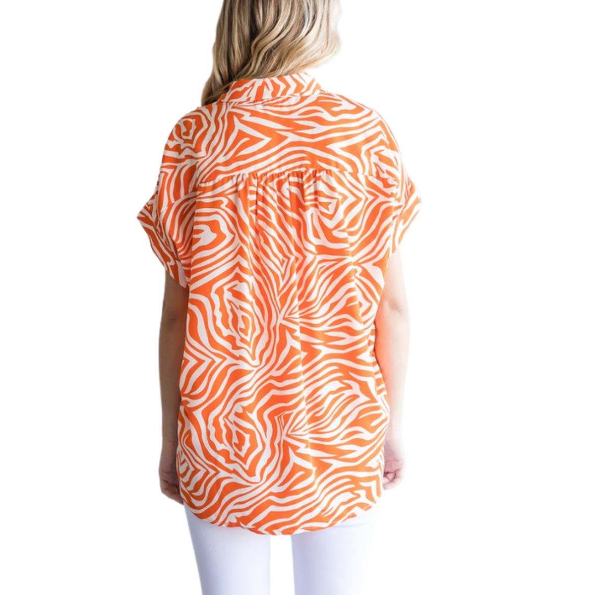 A woman with blonde hair, seen from behind, wears the FASHION GO Tiger Print Collared Button Up Top in orange and white with white pants against a plain white background.