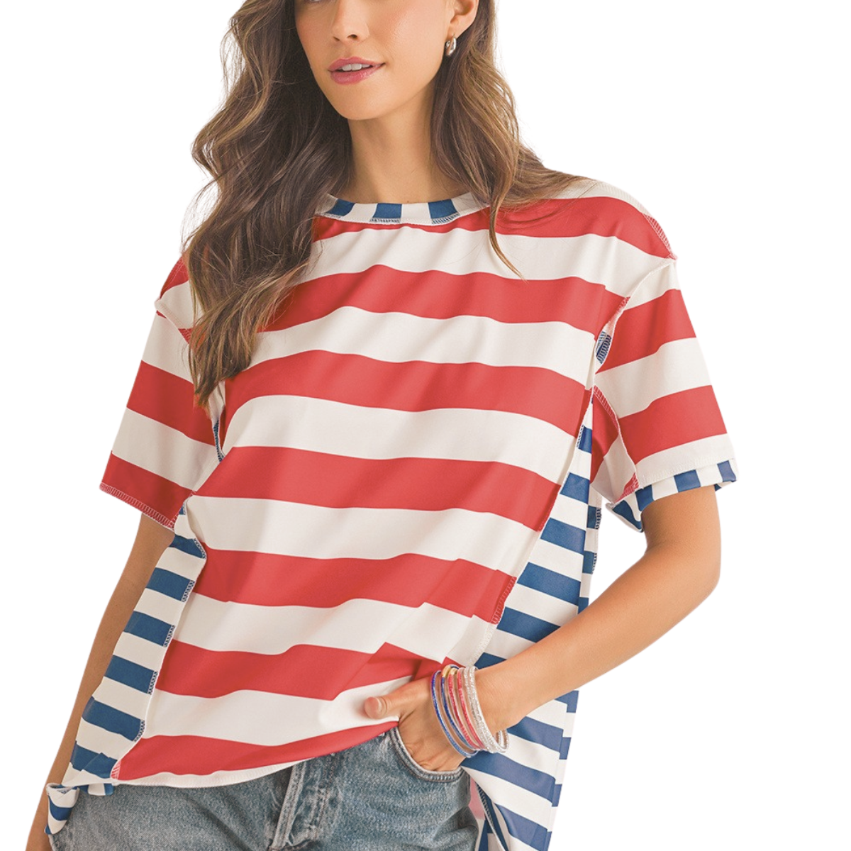 A woman wears the Shewin Stripe Loose Casual Color Block T Shirt, featuring red and white stripes in the center and blue and white on the sides, paired with denim jeans.