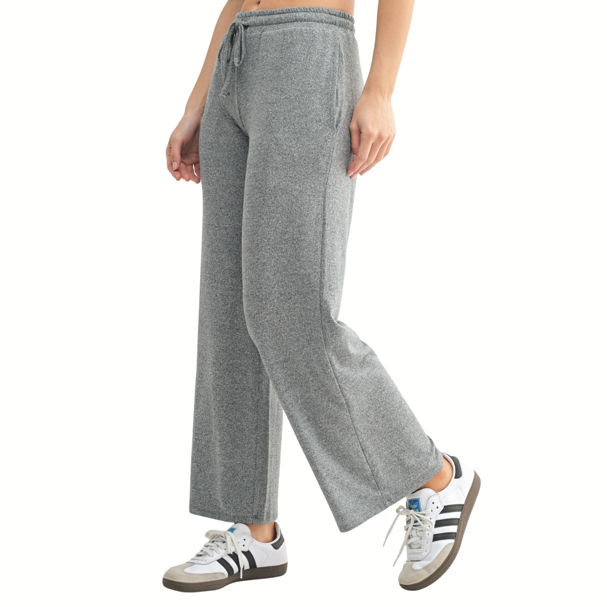 A person wearing the Mono B Brushed Hacci Boyfriend Tee and Wide Leg Pant Set, featuring buttery-soft fabric in gray, stands against a plain background.