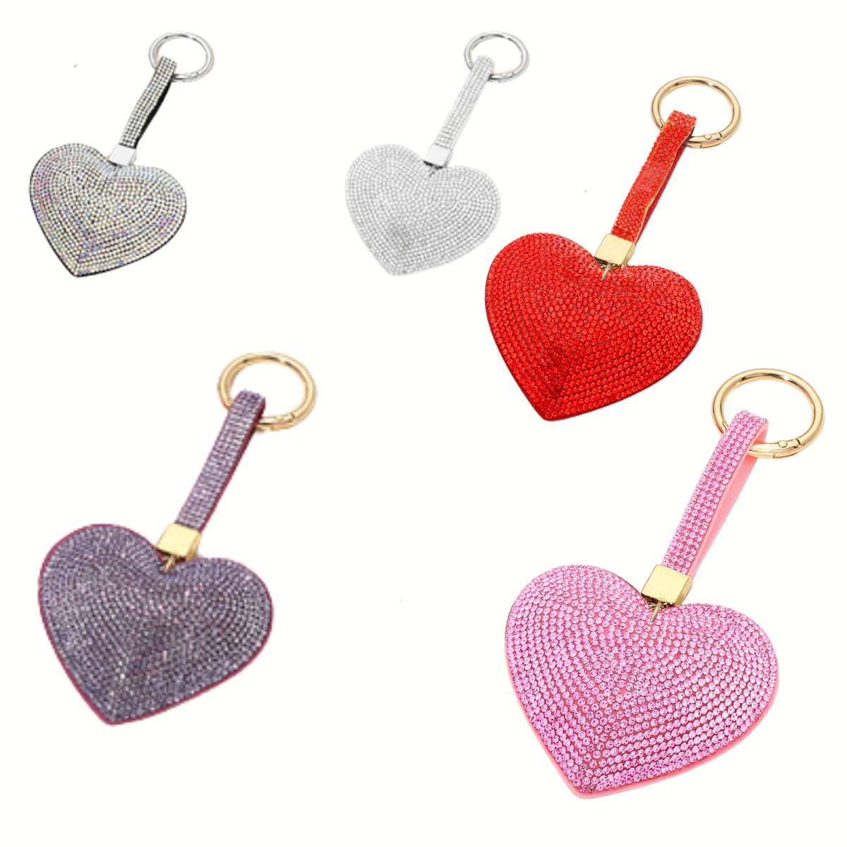 The Wona Trading Bling Heart Key Chain Bag Charm comes in black, silver, red, purple, and pink. Each rhinestone-accented heart is attached to a keyring—perfect as a sparkly accessory or bag charm.