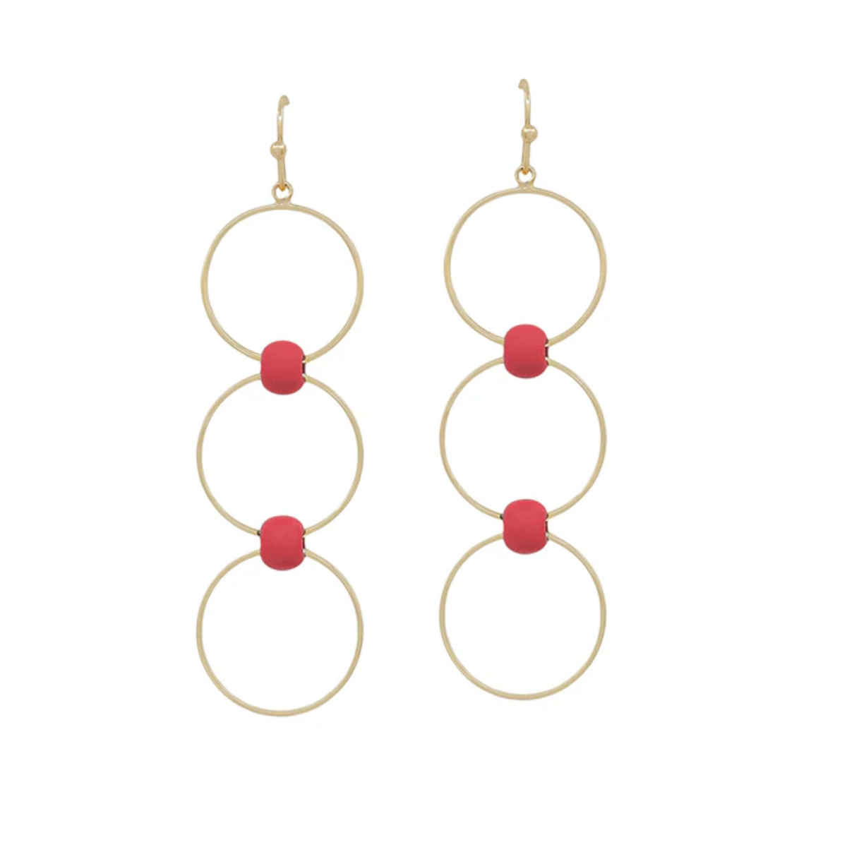 The Red and Gold Layered Circle Earrings by What's Hot feature three linked gold rings, each accented with a central red bead for a dainty look.