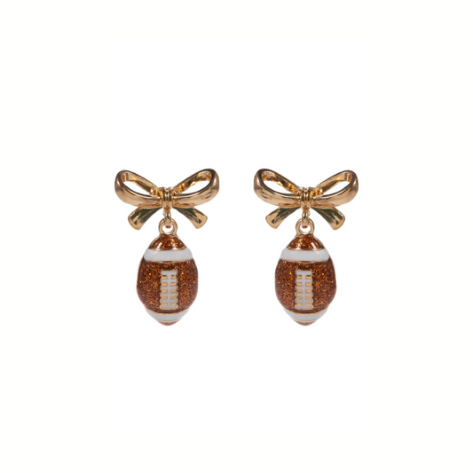 Show your team spirit with the Gold Bow Glitter Football Earrings by What's Hot, featuring sparkling brown football charms that dangle elegantly.