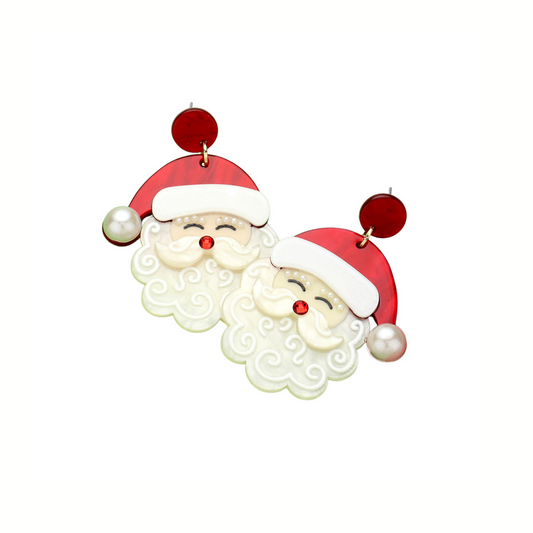 Add festive sparkle to your look with Wona Trading's Glittered Resin Santa Dangle Earrings, featuring cheerful Santa faces with red hats and pearl accents—the perfect holiday accessory.