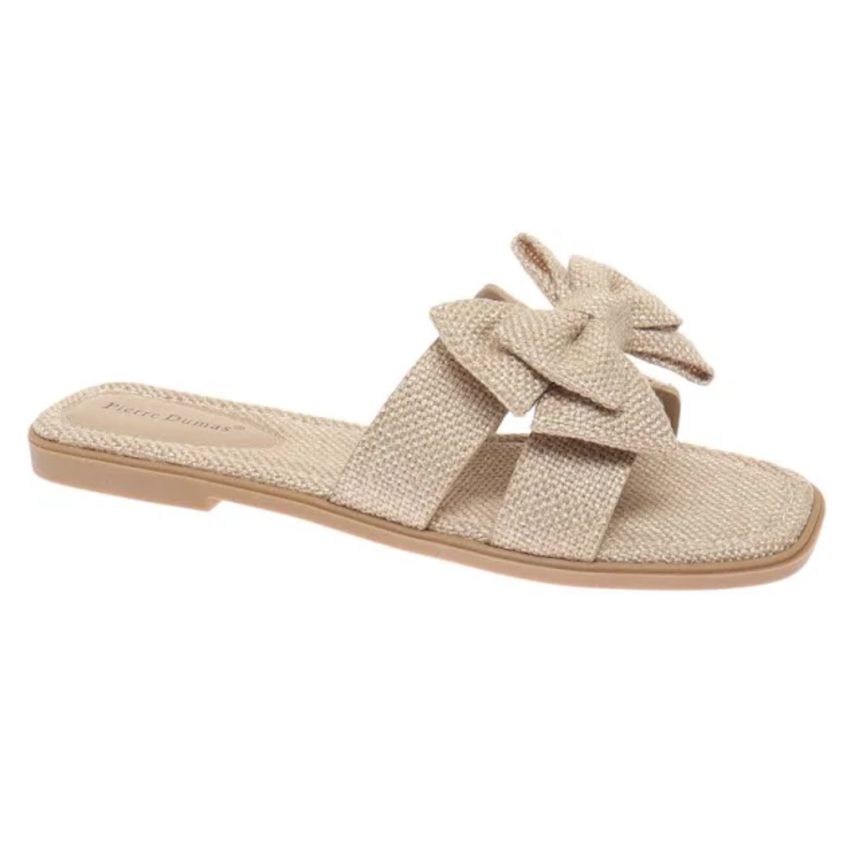 The Empress-32 Taupe Burlap Slide Sandals by Pierre Dumas from OLEM SHOE CORP are beige woven sandals with a double-strap design, featuring a decorative bow on the upper strap and a flat sole.