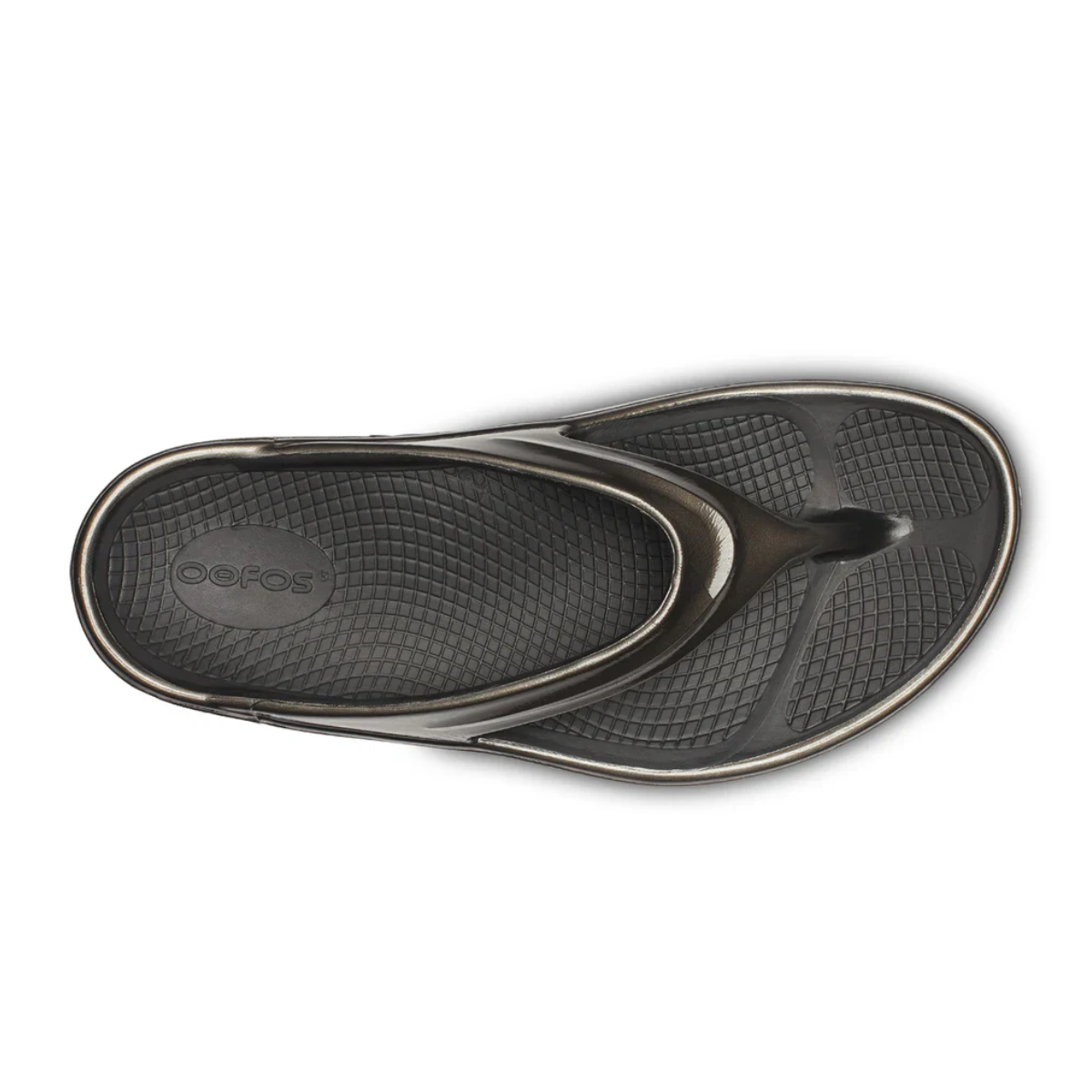 The OOFOS LLC OOmega OOlala in Titanium Mirror is a flip-flop sandal, shown from above on a white background, featuring a textured footbed, thong-style strap, and OOfoam™ technology for superior cushioning and arch support.