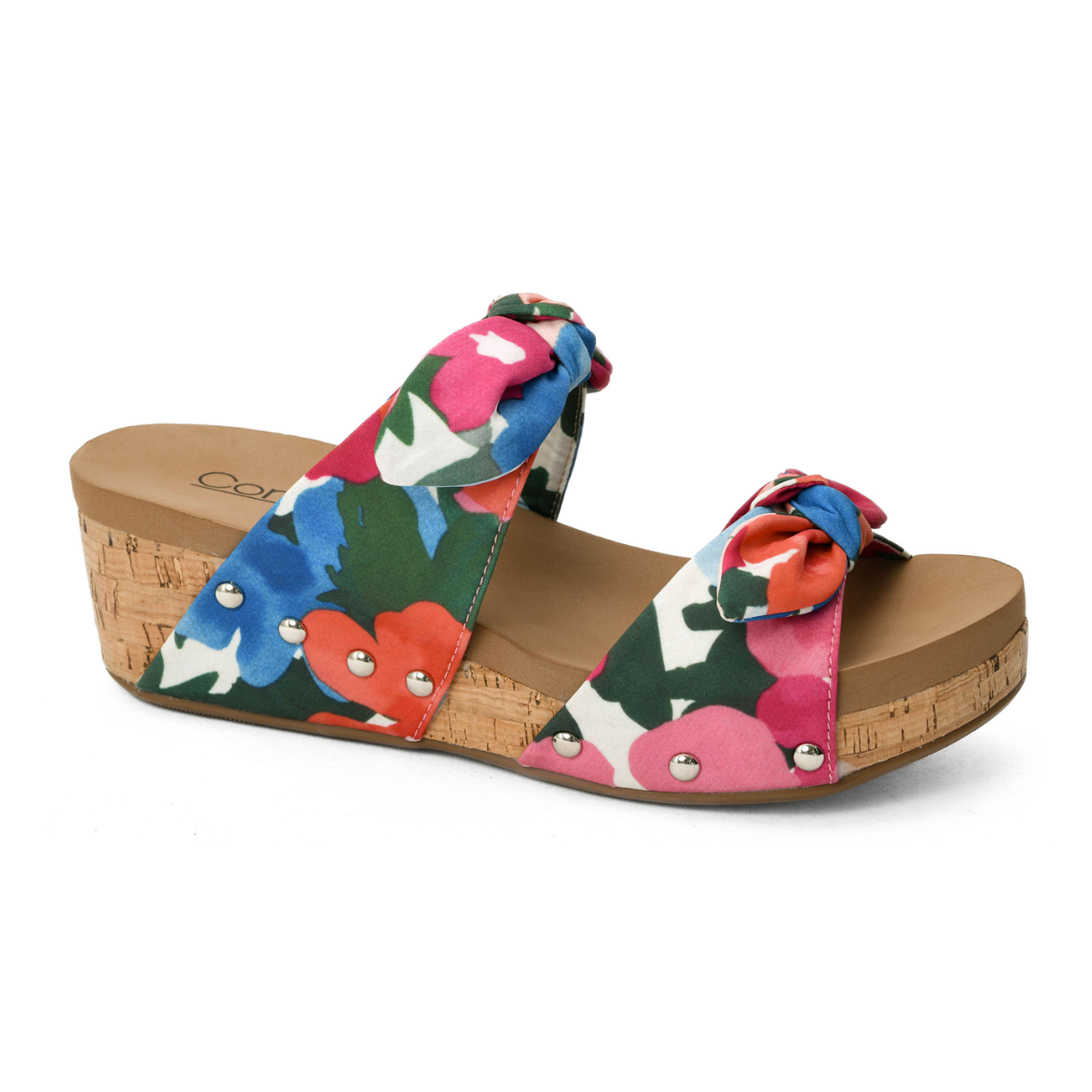 The Sitting Pretty Floral Print Wedge from CORKY'S FOOTWEAR INC features a colorful floral design, a cork sole, and bow details on the straps.