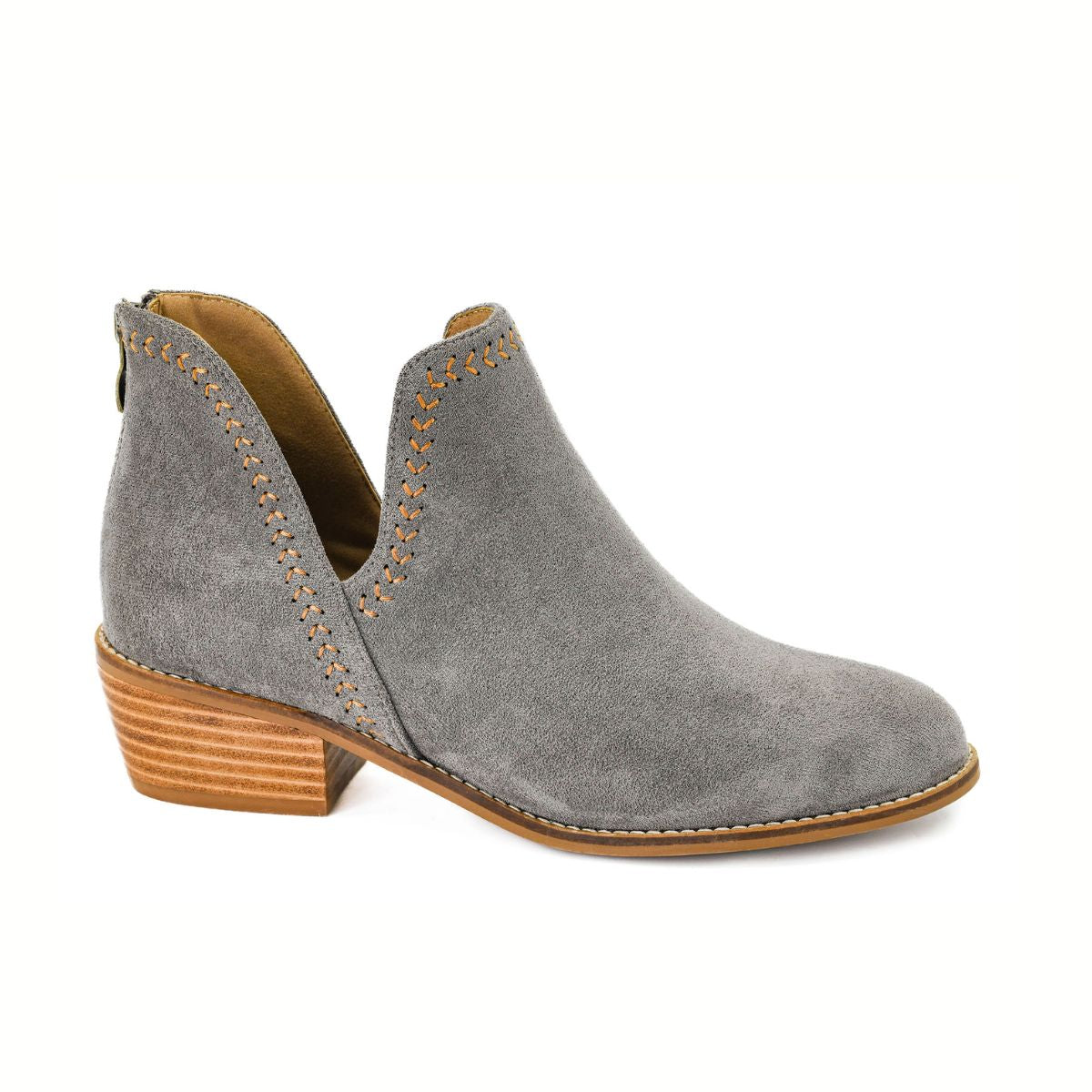 The Bluffin Grey Faux Suede Ankle Bootie by CORKY'S FOOTWEAR INC features tan stitching, a low stacked wooden heel, cushioned insole, and side cutout detail, shown on a white background.