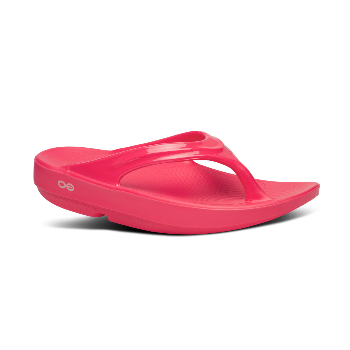 The OOlala Thong Neon Berry by OOFOS features a cushioned OOFoam footbed and toe separator strap, presented in a side view on a white background. Ideal recovery footwear for comfort and style.