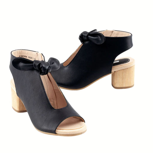 Step out in style with the Kimora Block Heel Peep Toe Shoe by Good Choice—black, heeled sandals with a wooden block heel and chic bow detail on the front.