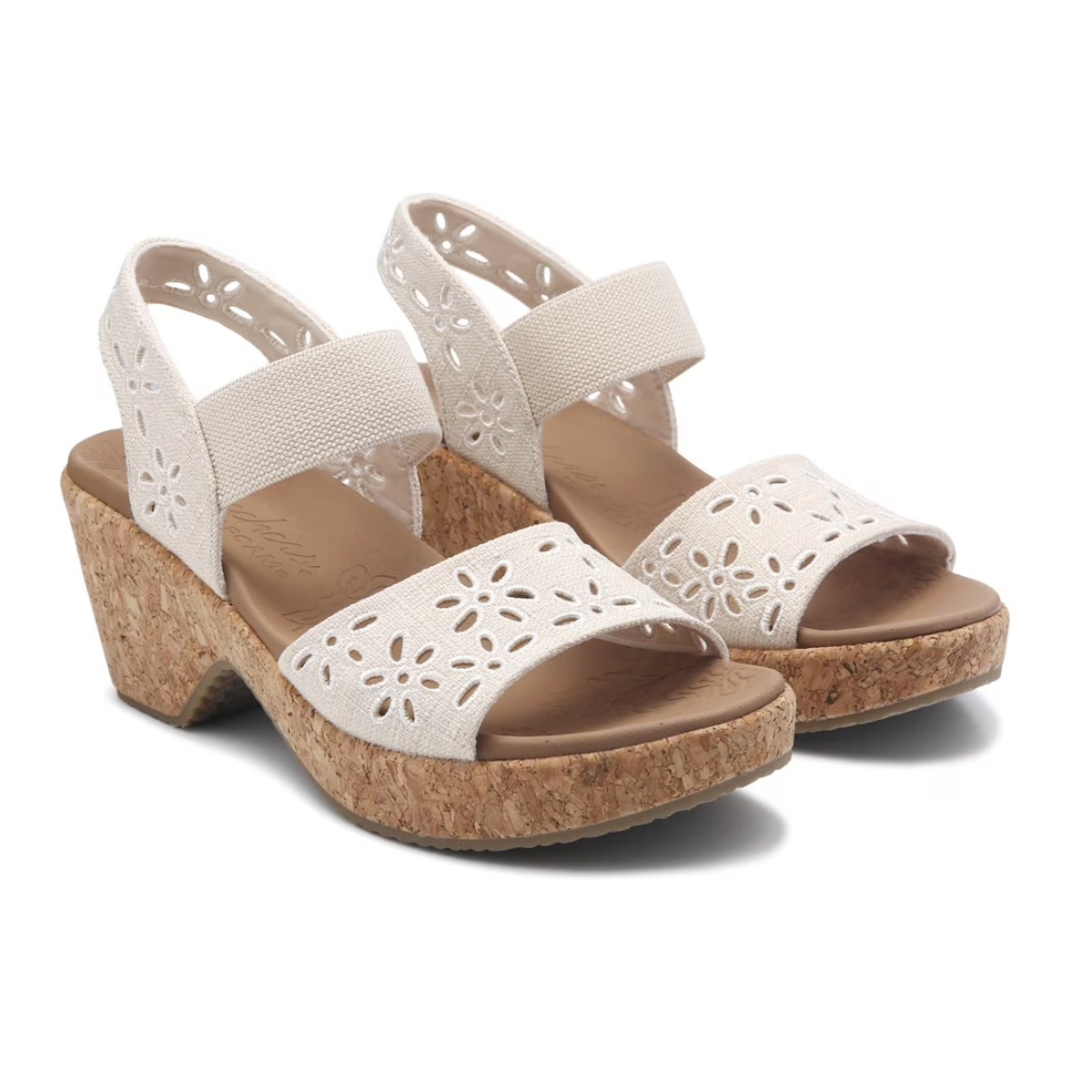 The Women's Bryson Beach Bliss Platform Sandal in Natural by SKECHERS features floral cutout designs, cork wedge heels, adjustable ankle straps, open toes, a Luxe Foam® footbed for comfort, and a flexible traction outsole on a pristine white background.