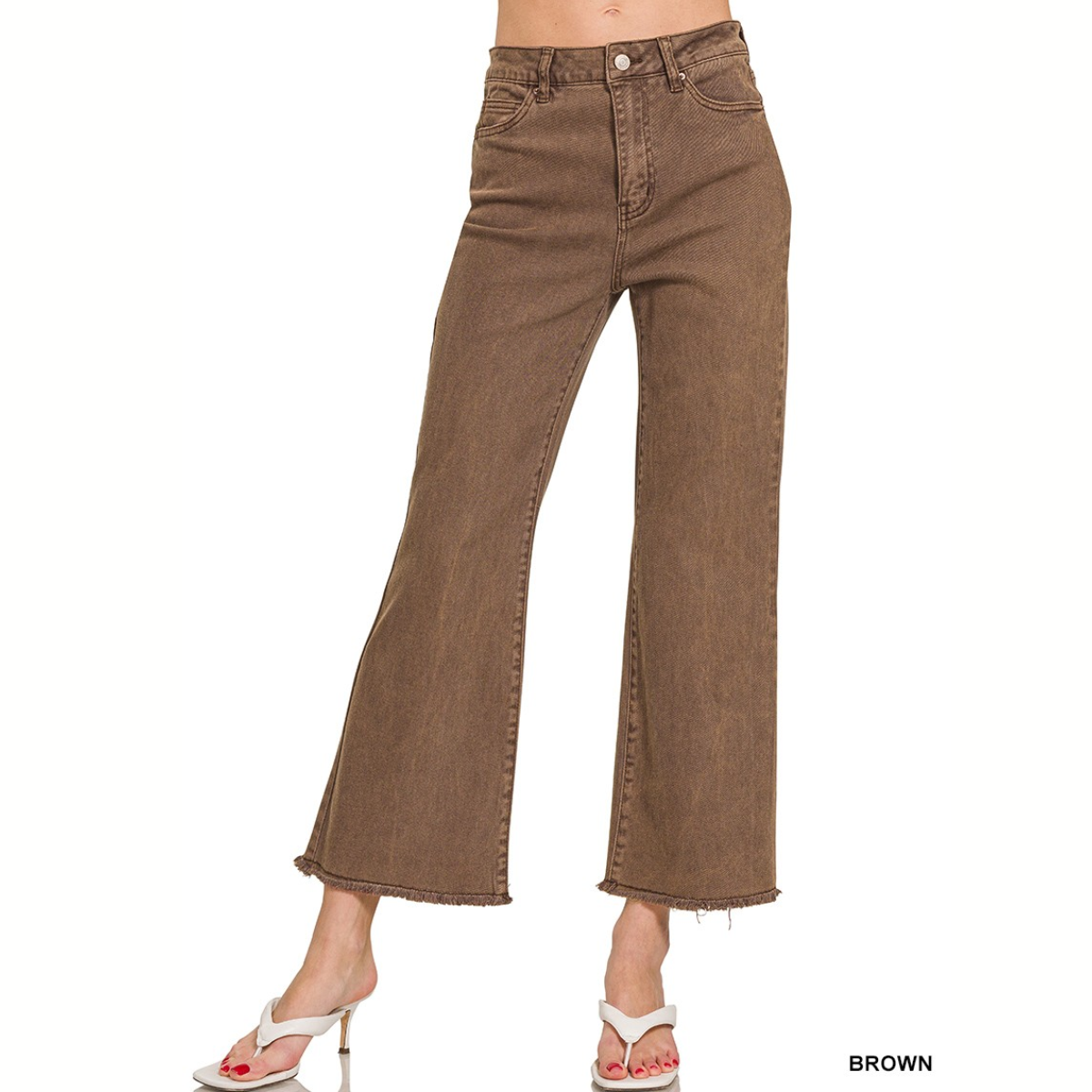 A person wears FASHION GO's Acid Washed High Waist Pants—wide-leg brown jeans with frayed hems, front pockets, and button closure—paired with white heeled sandals.